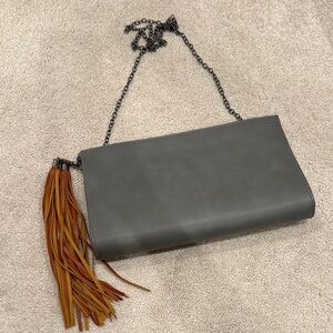 Lulu’s gray leather clutch
